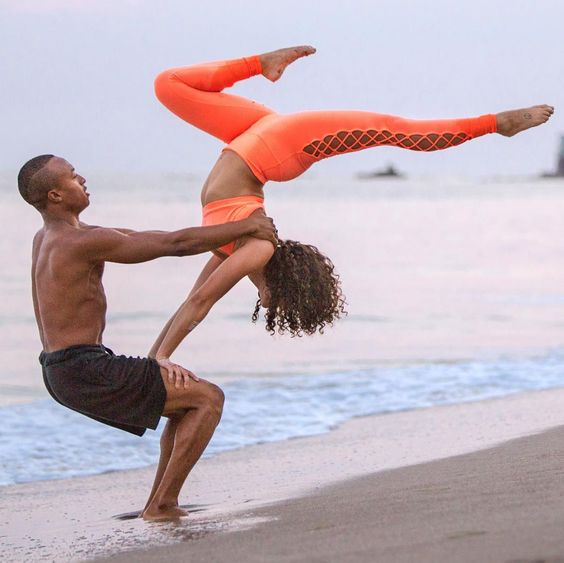 If you’re looking for one of the most fun couple yoga poses around, this is the one for you.